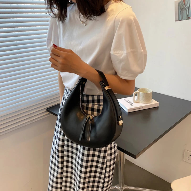 Crescent-shaped leather hobo bag