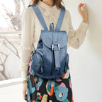 Leather knapsack with secure top flap