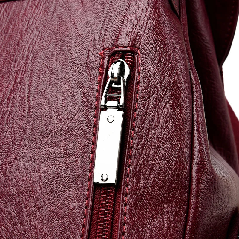 Leather knapsack with secure top flap