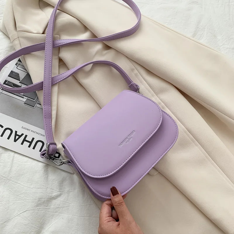 Compact leather sling crossbody