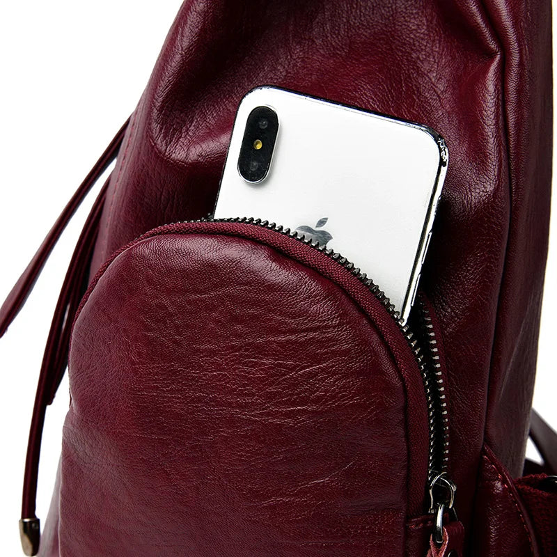 Leather knapsack with secure top flap