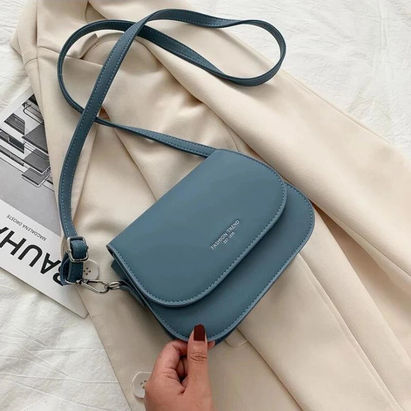 Compact leather sling crossbody