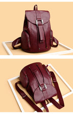 Leather knapsack with secure top flap