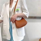 Minimal leather sling crossbody