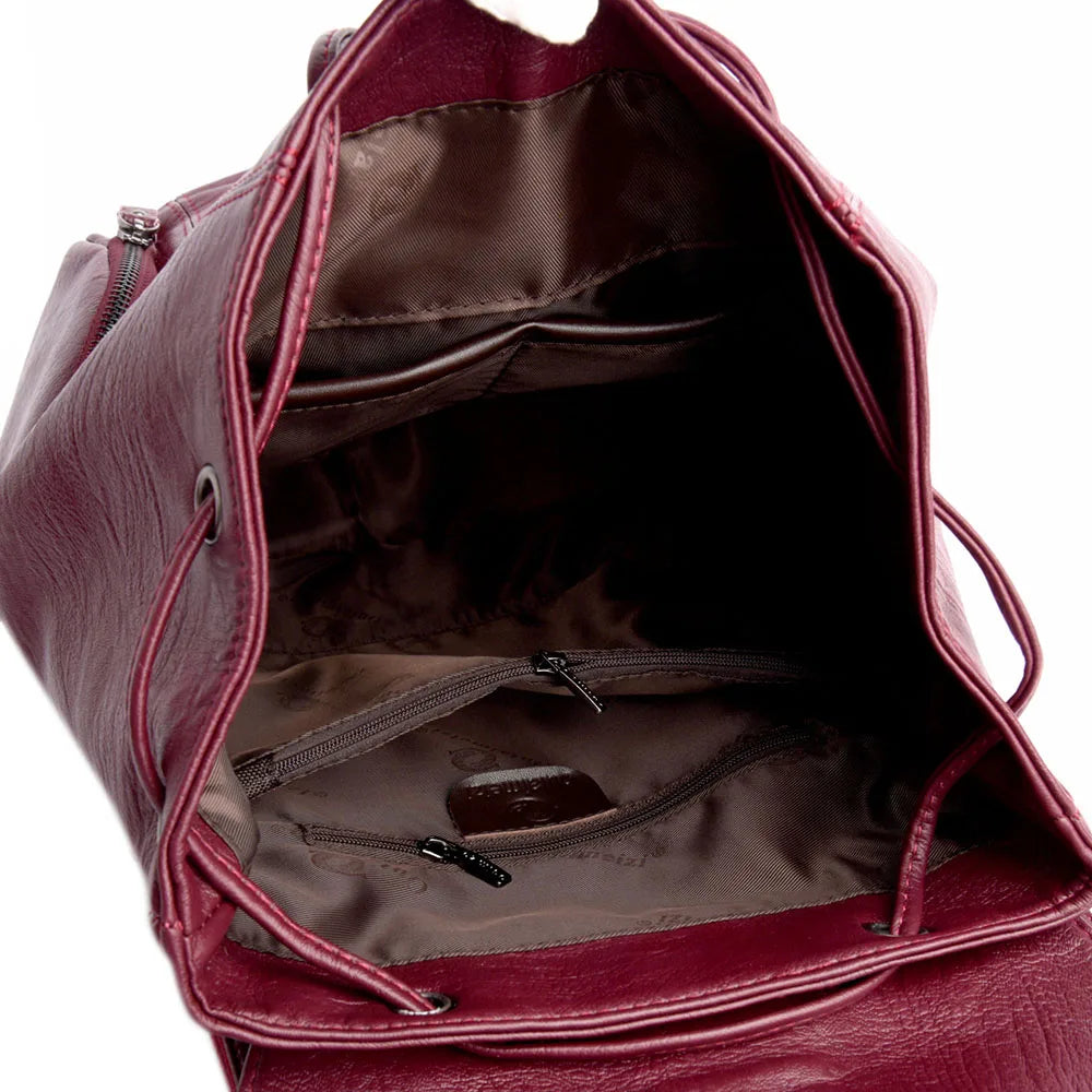Leather knapsack with secure top flap