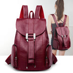 Leather knapsack with secure top flap