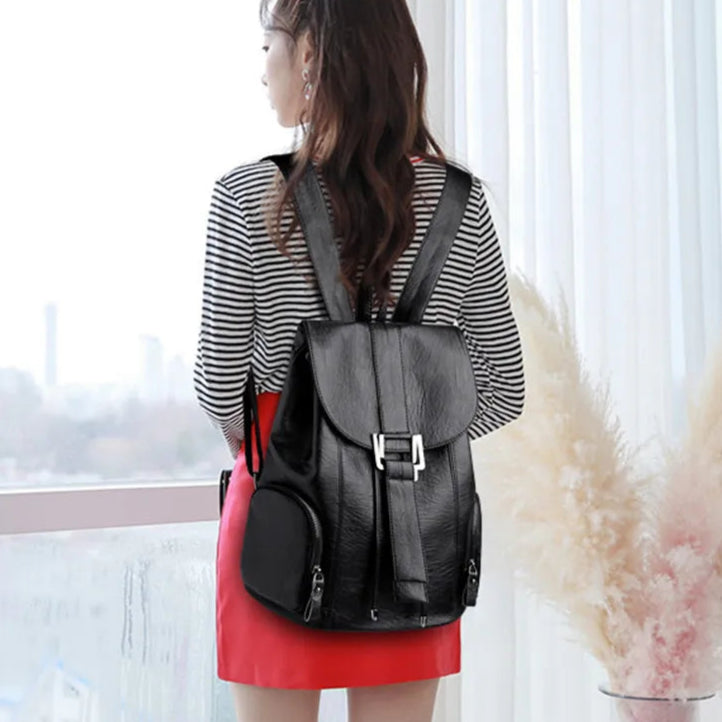 Leather knapsack with secure top flap