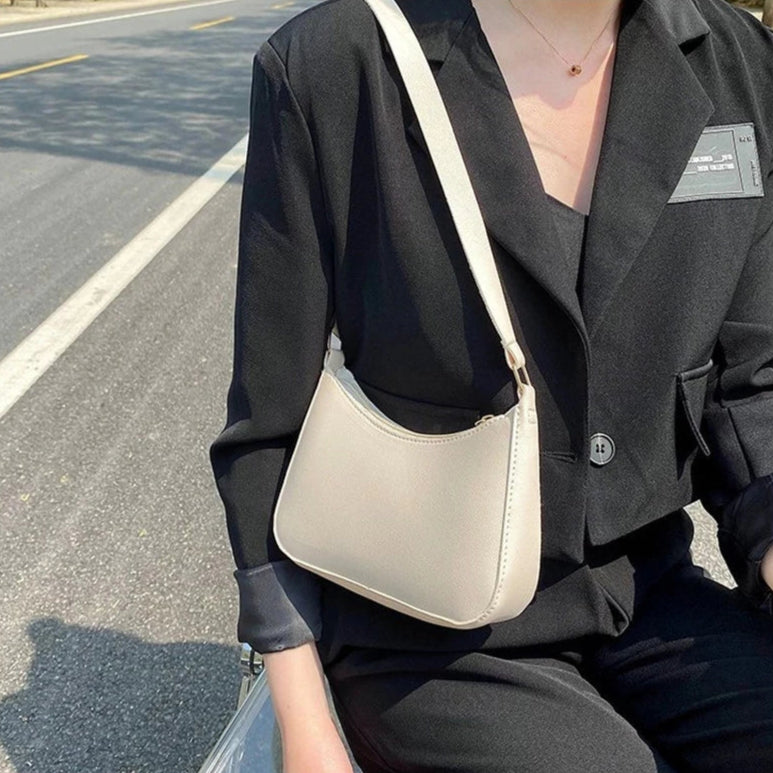 Minimal leather sling crossbody