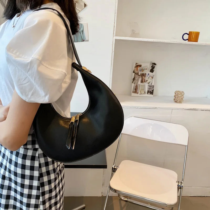 Crescent-shaped leather hobo bag