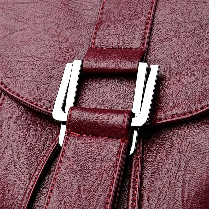 Leather knapsack with secure top flap
