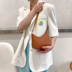 Minimal leather sling crossbody