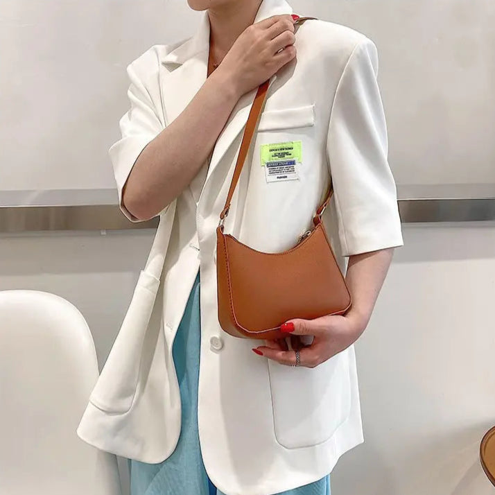 Minimal leather sling crossbody