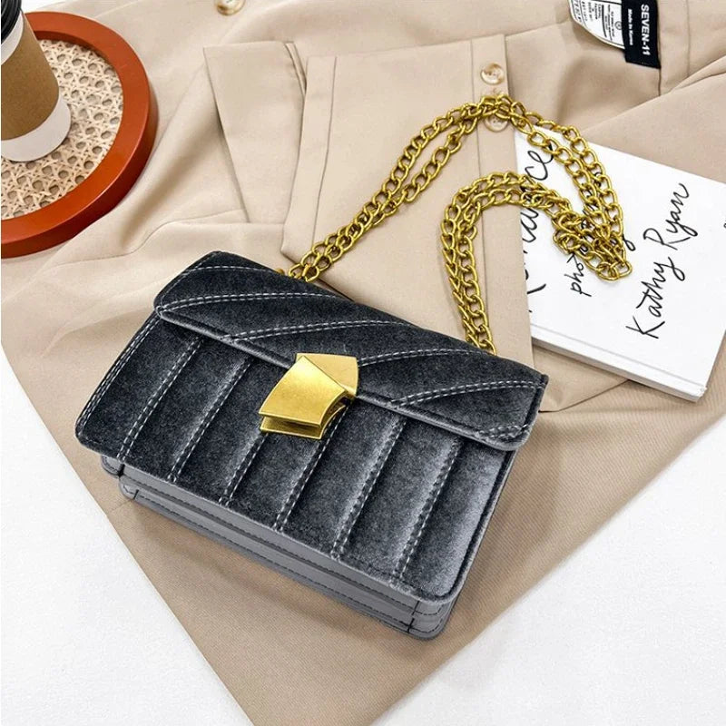 Corduroy handbag with chain and flap closure