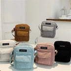 Corduroy crossbody handbag with front pocket