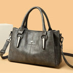 Leather handbag with detachable shoulder strap