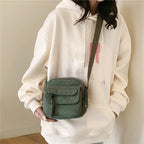 Small corduroy handbag with front zipper pocket