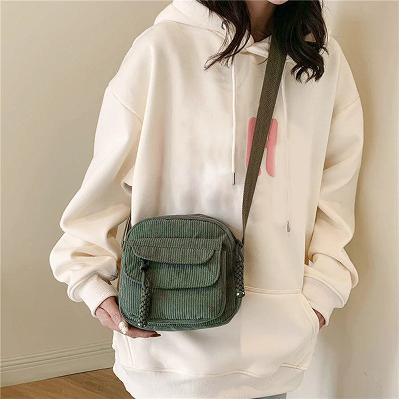 Small corduroy handbag with front zipper pocket