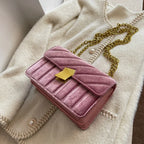 Corduroy handbag with chain and flap closure