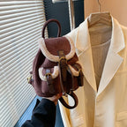 Suede backpack with front pockets