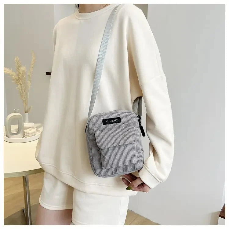Corduroy crossbody handbag with front pocket