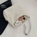Versatile corduroy handbag with shoulder strap