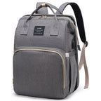 Grey diaper backpack with built-in bed