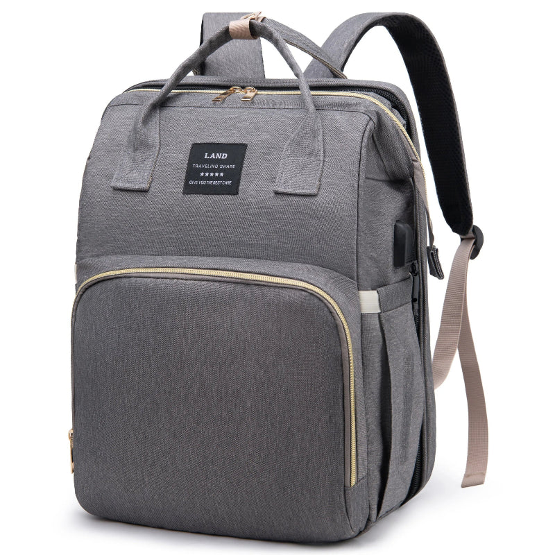 Grey diaper backpack with built-in bed