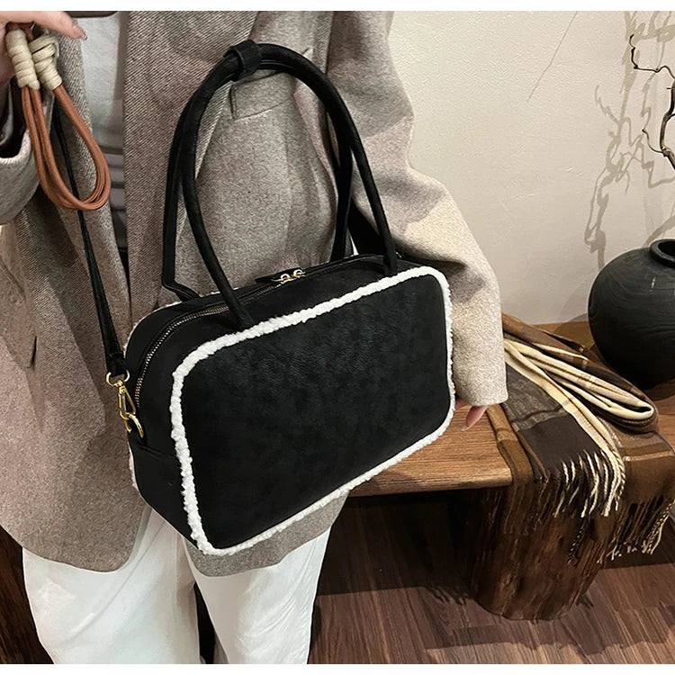 Elegant suede handbag with vintage charm