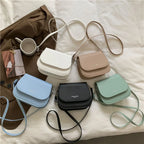 Compact leather sling crossbody