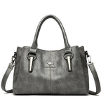 Leather handbag with detachable shoulder strap