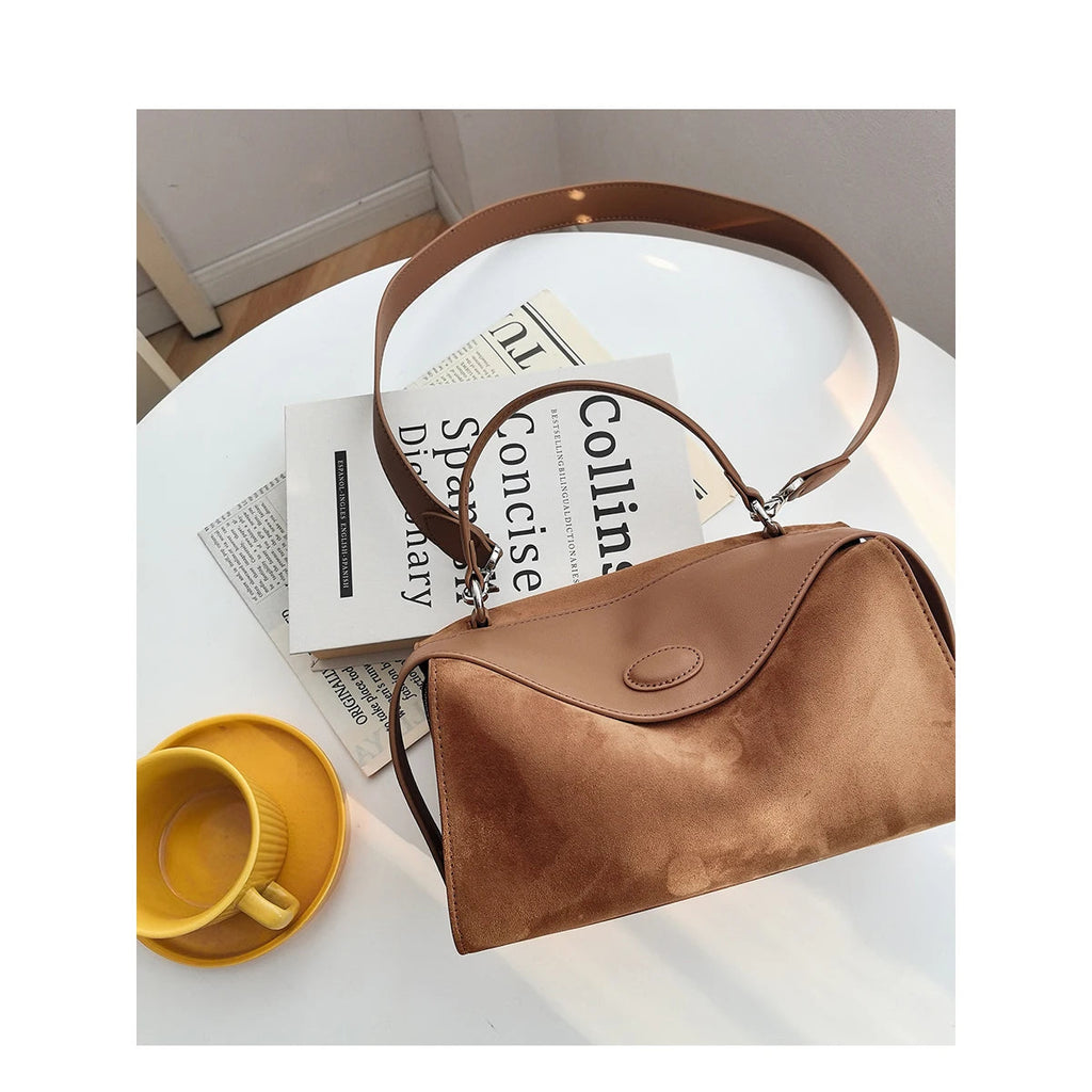 Suede handbag with subtle colors