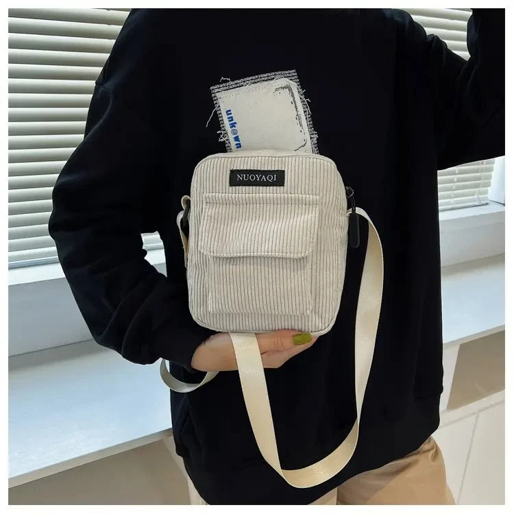 Corduroy crossbody handbag with front pocket