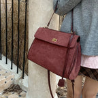 Structured modern suede handbag
