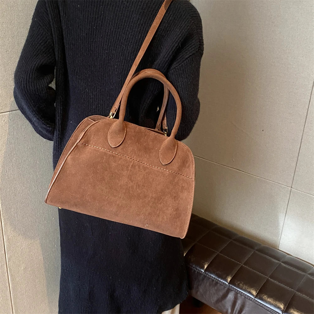 Suede handbag with shoulder strap