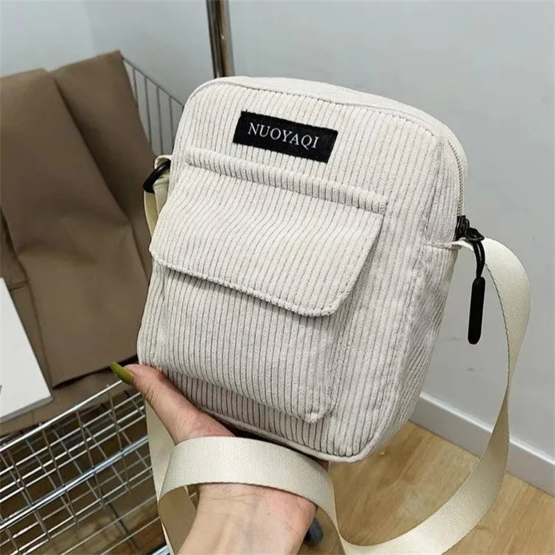 Corduroy crossbody handbag with front pocket