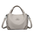 Leather handbag with wide base
