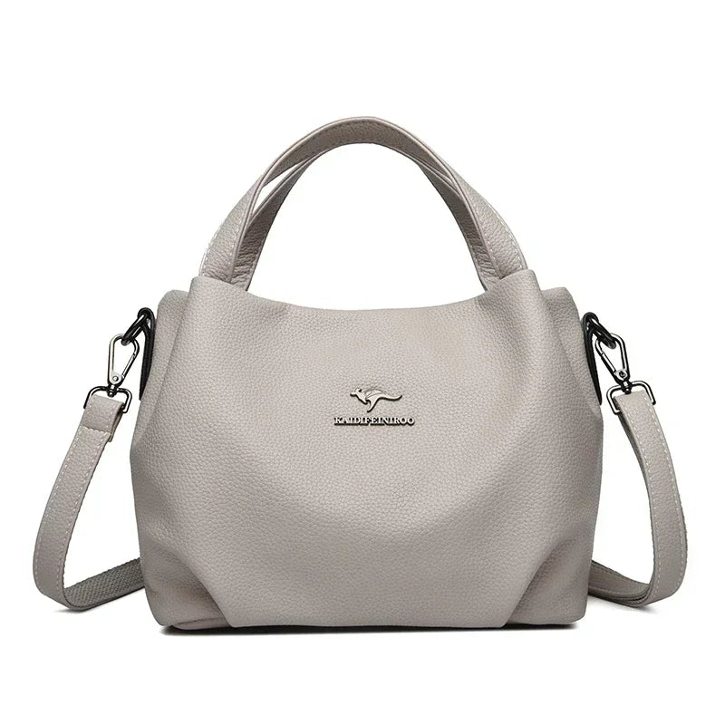 Leather handbag with wide base