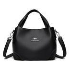 Leather handbag with wide base