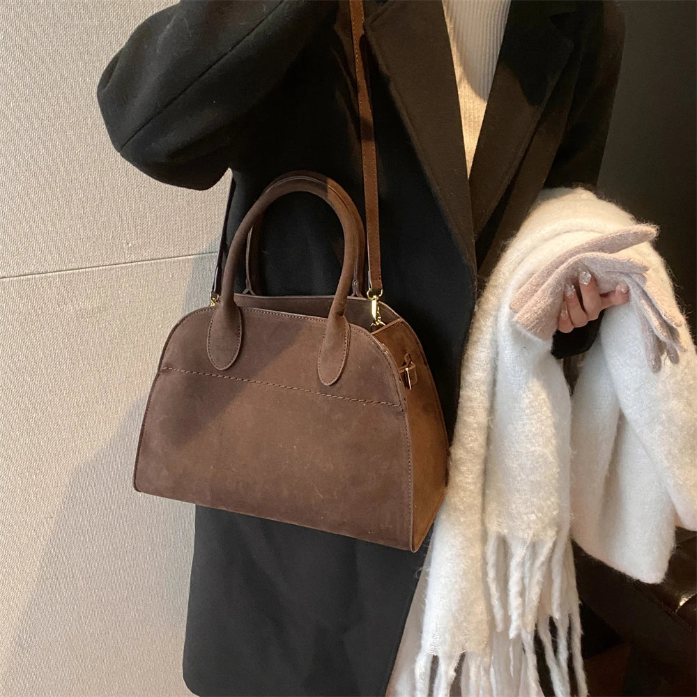Suede handbag with shoulder strap