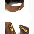 Suede handbag with rounded handles and zip closure