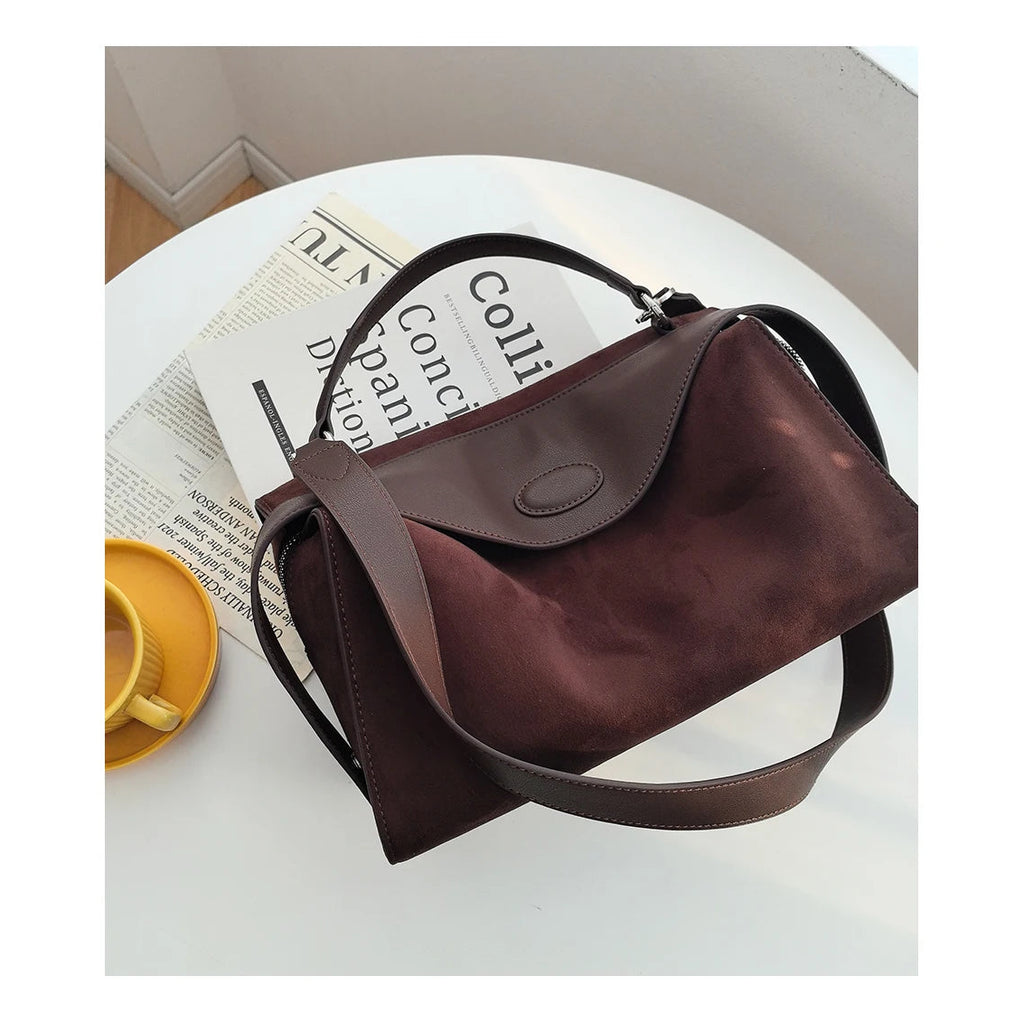 Suede handbag with subtle colors