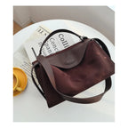 Suede handbag with subtle colors
