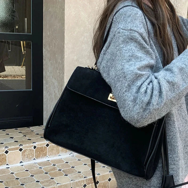 Structured modern suede handbag