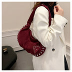 Chic suede shoulder bag with decorative strass