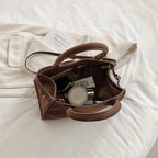 Suede handbag with double handle