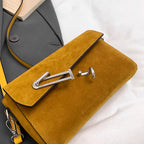 Structured suede handbag with minimalist shape