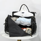 Elegant leather holdall with shoulder strap