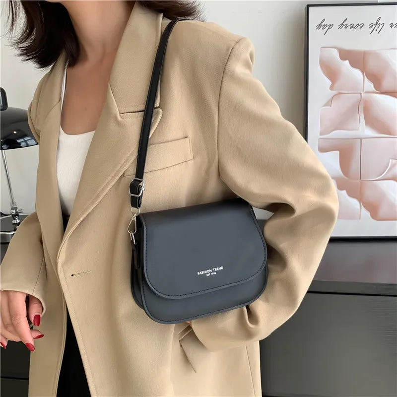 Compact leather sling crossbody