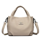 Leather handbag with wide base