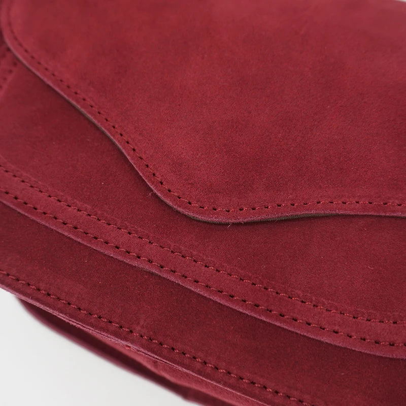 Fold-over suede shoulder bag